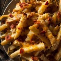Bacon Cheese Fries · Shredded cheese, bacon and green onions over french fries served with ranch.