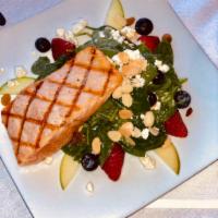 Grilled Salmon Salad  · Spinach, strawberries, blueberries, apples, golden raisins, toasted almonds, feta cheese and...