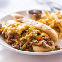 Classic Philly Cheesesteak Sandwich  · Thinly sliced Philly meat, sauteed onions, peppers, Cajun cheese sauce and hoagie bun.