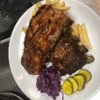 Baby Back Ribs  · Smoky and sweet BBQ ribs, hand cut fries, cabbage slaw and butter pickles.