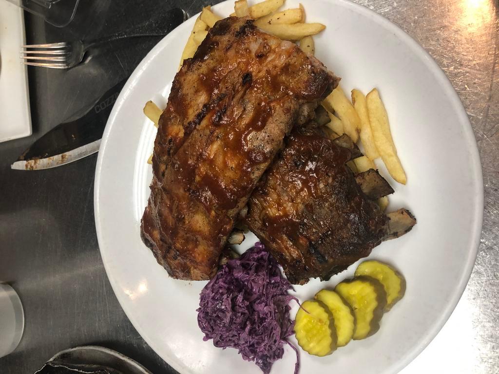 Baby Back Ribs · Smoky and sweet BBQ ribs, hand cut fries, cabbage slaw and butter pickles.