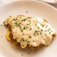 Chicken Fried Steak · Loaded mashed potatoes and pepper country gravy.