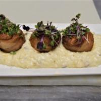 Bacon Wrapped Diver Scallops  · Bacon, mushroom risotto and Cajun lobster sauce.