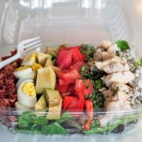3. Cobb Salad · Tomato, avocado, chives, hard-boiled eggs, bacon, chicken and blue cheese over mixed greens.