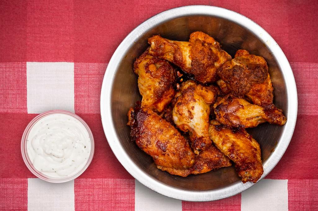 Buffalo Wings · Our oven-roasted Buffalo wings have just the right blend of spices to give them the true 