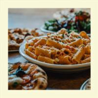 Chicken Riggies · Rigatoni pasta tossed with house-made riggie sauce, hot & sweet peppers, caramelized oni...