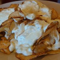 TDC Bleu Chips · Homemade potato chips topped with our homemade signature bleu cheese.