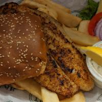 TDC Fish Sandwich · Crispy fried grouper filet on a toasted bun. Served with homemade tartar sauce and fries. Al...