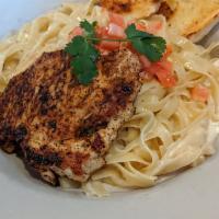 Alfredo Chicken · Grilled chicken breast on a bed of fettuccine. Cooked in alfredo sauce.