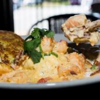 Shrimp and Grits · Grilled or blacked shrimp in a Southern sausage cream sauce served over creamy grits.