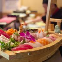 Love Boat for 2 · 10 pieces sushi, 18 pieces sashimi, shrimp tempura roll and eel roll.