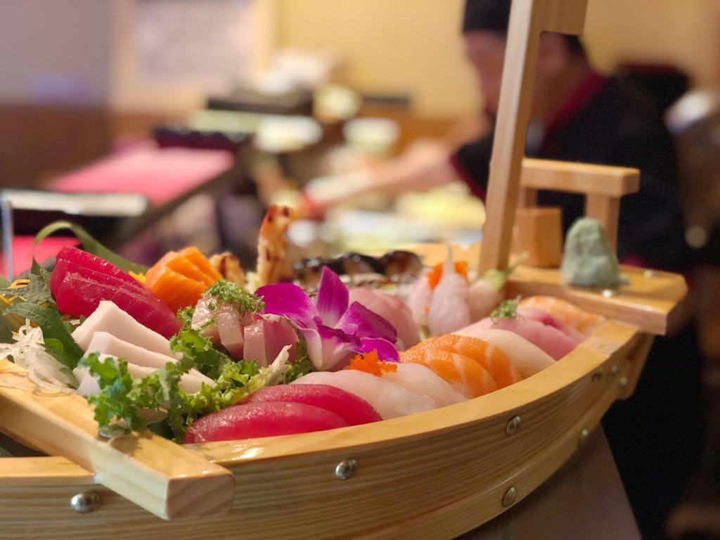 Love Boat for 2 · 10 pieces sushi, 18 pieces sashimi, shrimp tempura roll and eel roll.