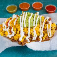 Nachos · Nachos. Fried tortilla chips served with Mexican cheese, tomatoes, grilled corn, topped with...