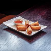 Spring Rolls · Vegetable mix, fried till crispy, house-made sweet chili sauce.