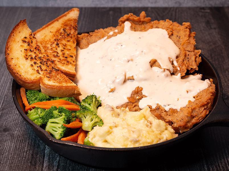 Texas Sized Kobe Beef Chicken Fried Steak · Southern-style battered, local Texas certified akaushi Kobe beef. Served with mashed potatoes, steamed seasonal veggies, Texas toast, and cream gravy.