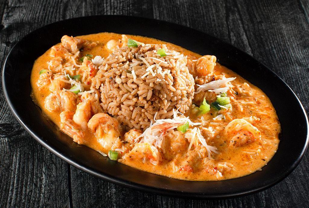 Oscar Seafood Etoufee · Our famous oscar sauce, shrimp, crab and crawfish. Served with dirty rice.