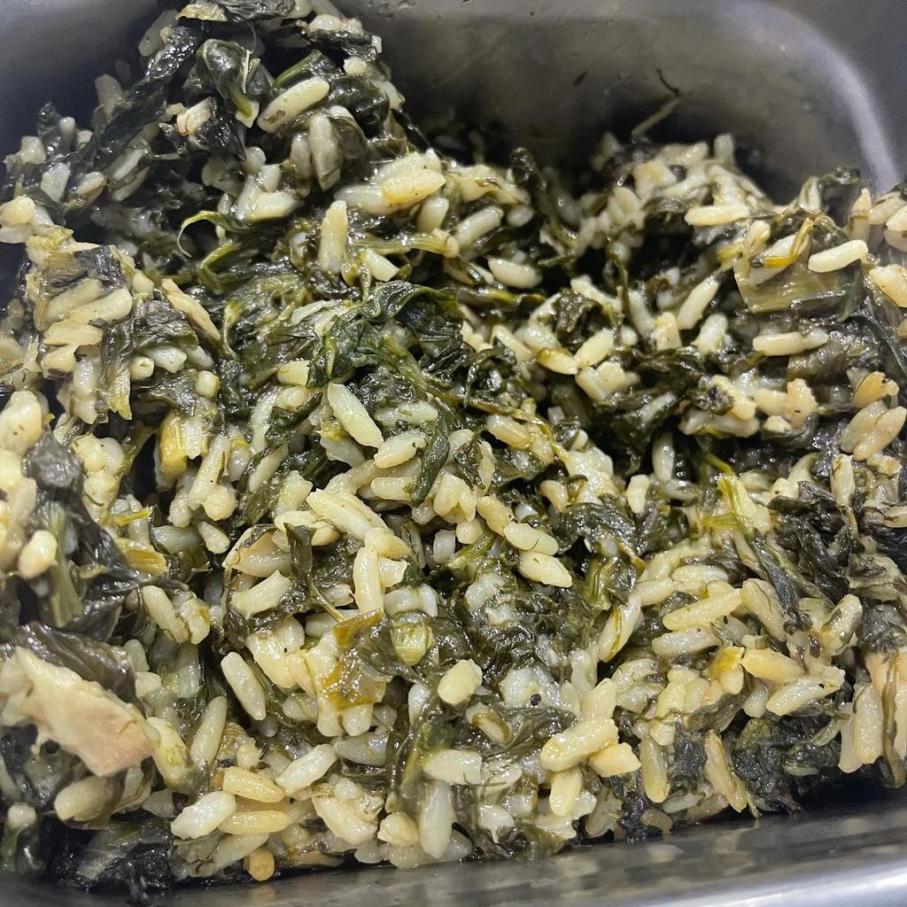 Spanakorizo · Baked fresh spinach, dill, scallions mixed with rice.
