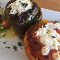 Yemista  · Peppers and tomato stuffed with ground beef, rice, and feta cheese.
