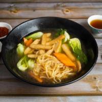 Veggie Chicken Noodle Soup · Thin wheat noodles, soy chicken strips with spinach, carrot and mushrooms served with veggie...