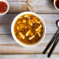 18. Hot and Sour Soup with Won Tons · Mushroom, soy chicken, tofu and carrots in spicy and sour broth with wontons. Small 4PC, lar...