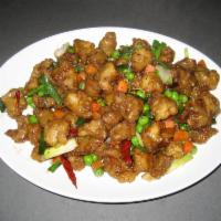 Szechuan Pork · Thinly battered pork in a sweet and spicy sauce with peas, carrots, green onions, and red ch...