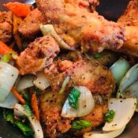 Salt and Peppered Wings 12pcs · Fried wings stir fried with onion carrots, salt and peppers 