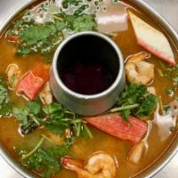 Seafood Tom Yum Soup · Served with White Rice,
Shrimp, Fillet Fish, Squad, Clam, Imitation Crab Meat
Ginger and Lem...