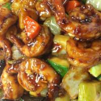 Spicy Kung Pao Shrimp · Spicy shrimp stir fried with celery, zucchini, carrots, water chestnuts, peanuts, and topped...