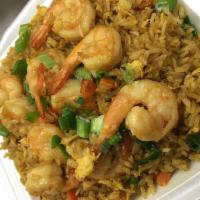 Shrimp Curry Fried Rice  · Curry fried rice stir fried with shrimp, eggs, onions, peas, and carrots topped with green o...