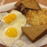 56. American Breakfast · 2 jumbo eggs any style, hash browns, toast and your choice of ham, bacon, sausage.