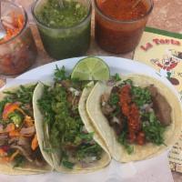 Tacos Especialidad · Carne asada, grilled chicken, al pastor, carnitas.