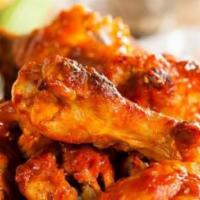 Buffalo Wings · Served in our special Buffalo sauce with celery, a side of french fries and your choice of r...