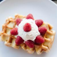 The Sunshine Waffle · Lemon curd, fresh raspberries and whipped cream.