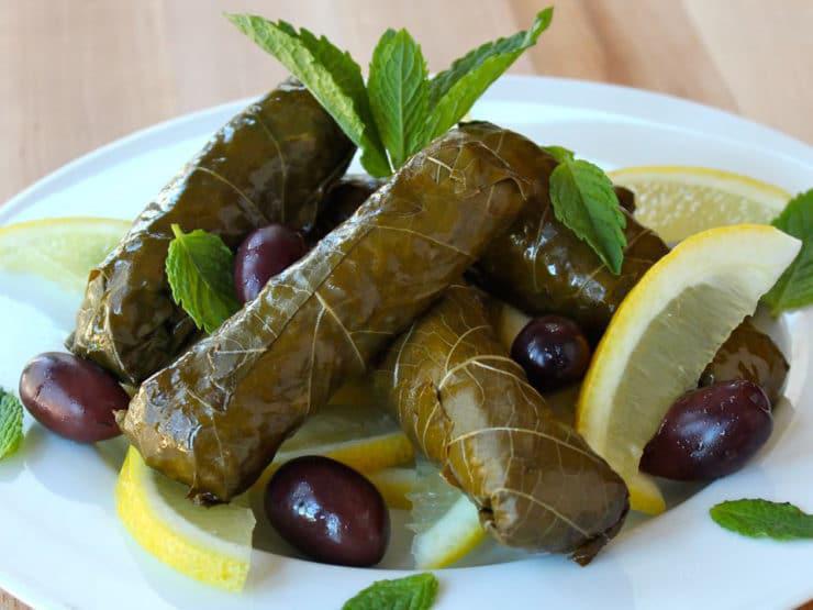 11. Small Grape Leaves · Grape leaves stuffed with rice, dry mint, black pepper and onions.