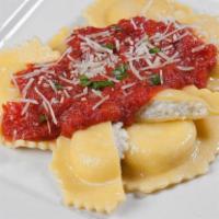 Cheese Ravioli Parmigiana · Cheese filled raviolis in our famous marinara suace  baked with mozerella cheese (side of It...