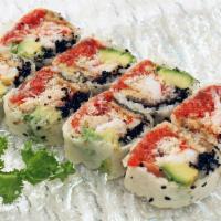Shima Roll · Spicy tuna, snow crab, eel, tobiko, avocado and crunchy flakes rolled up with sesame soy sea...