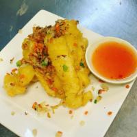 Fried Calamari · Tender pieces of squid fried in a light and crispy batter.