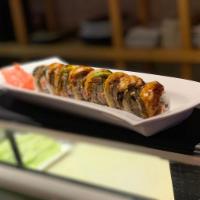 Dragon Roll · Kani, cucumber topped with eel, avocado, tobiko and eel sauce.