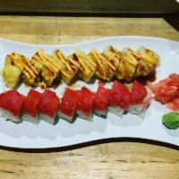 Graham Roll · Deep-fried shrimp tempura, crabstick, avocado, cream cheese topped with eel sauce and spicy ...