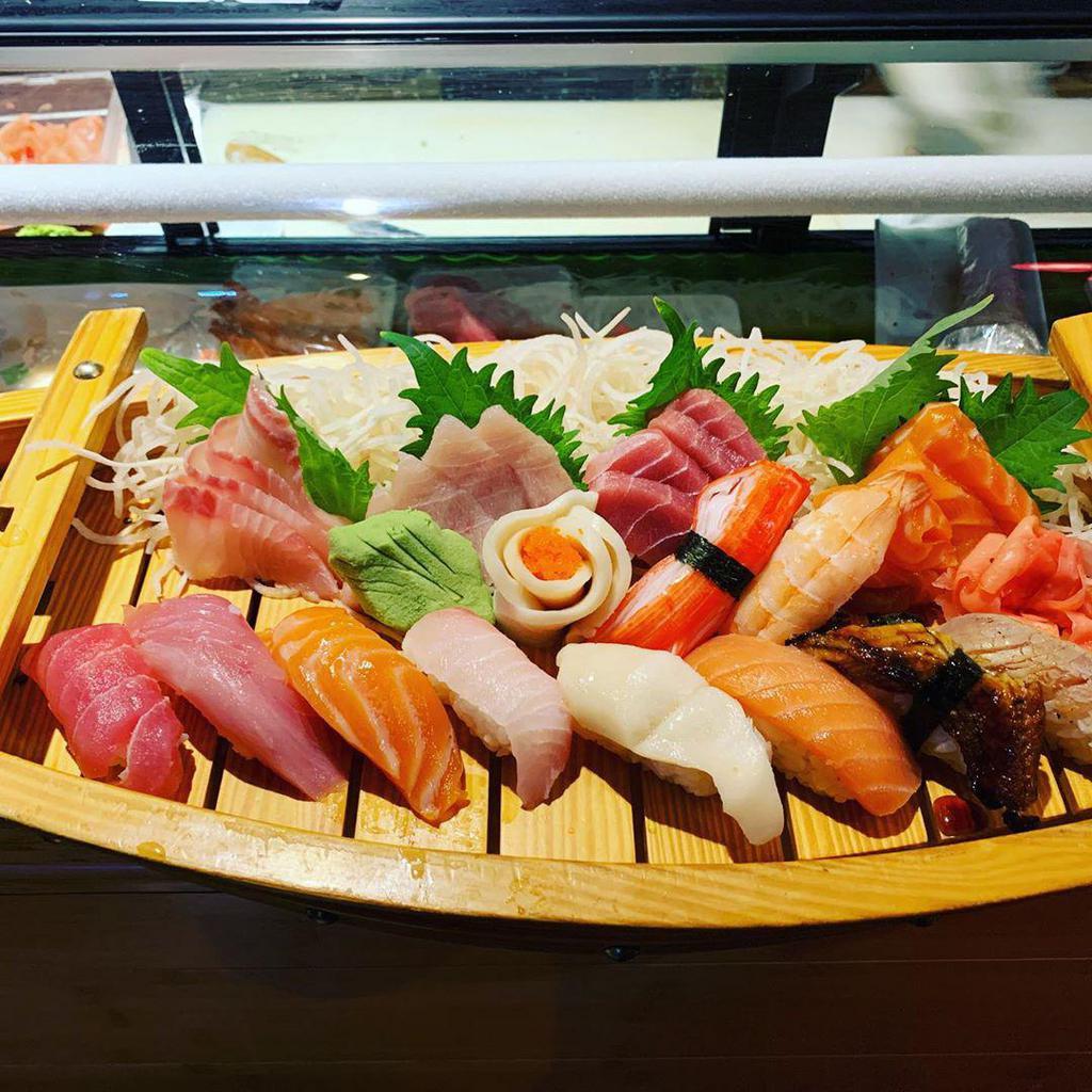 Deluxe Sushi and Sashimi · 10 pieces of sushi and 10 pieces of sashimi.