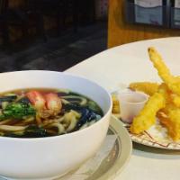 Shrimp Tempura Udon · Wheat noodles with homemade broth topped with scallion, wakame seaweed, served with shrimp t...