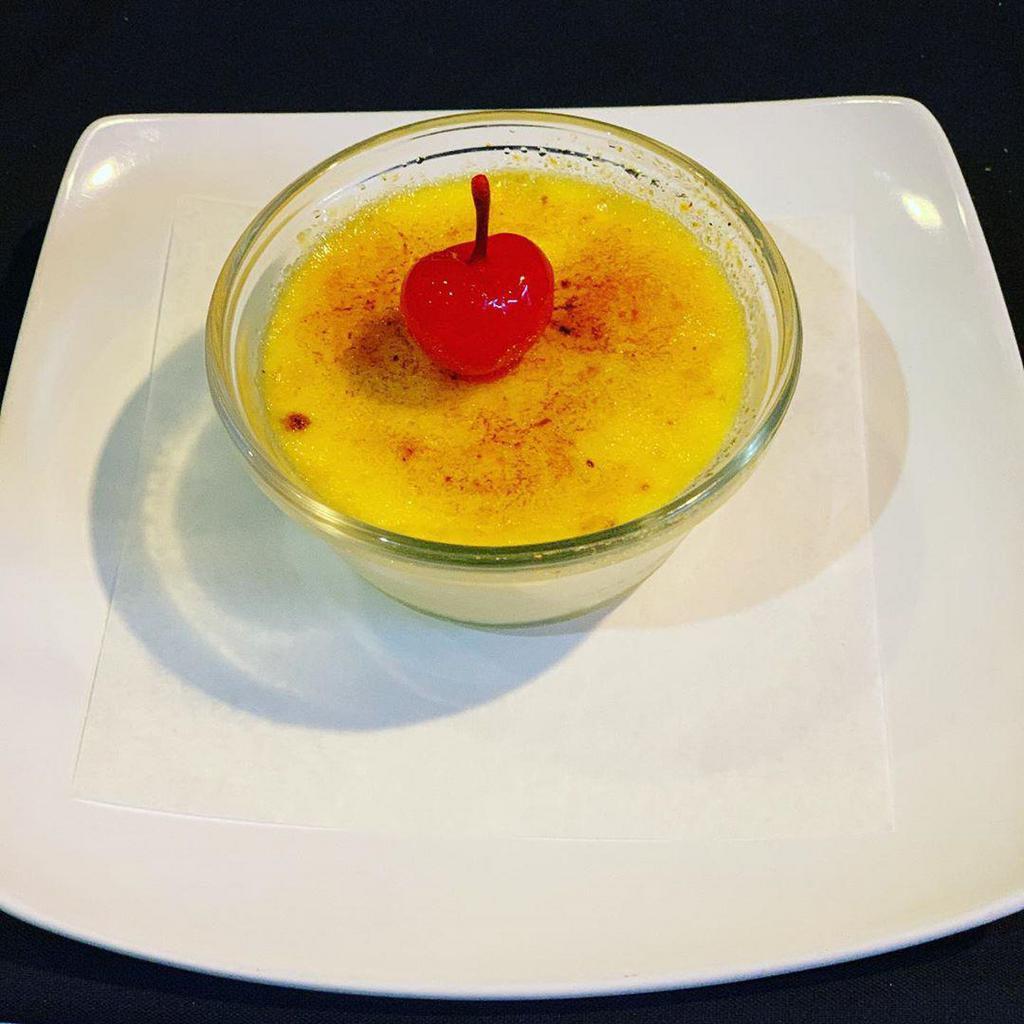 Creme Brulee · Decadent homemade custard with a beautifully torched sugar crust.