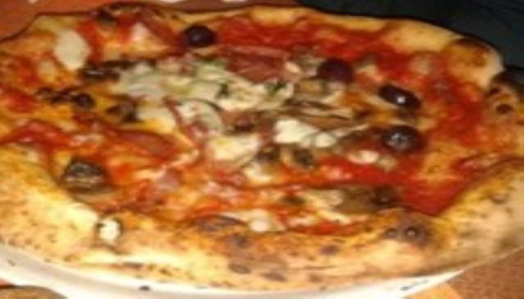 Capricciosa ·  Tomato Sauce, Artichokes, Mushrooms, Italian Cooked Ham, Fresh Mozzarella, Basil 