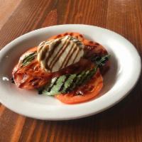 Buratta Salad - New · fresh burrata, sliced tomato, fresh basil, drizzled with balsamic reduction,
served with cr...