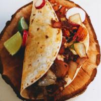 Taco alambre · Served in flour tortilla come with pastor meat, bacon, bell peppers, onions, cheese.