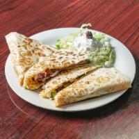 Greek Quesadilla · Gyro meat, mixed cheese, feta cheese, tomato, onion, green pepper, and Kalamata olives in a ...