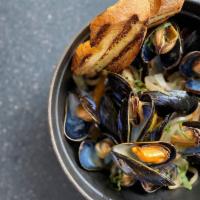 P.E.I. Mussels · onion, garlic, fennel, tomato, white wine, herbs, grilled baguette