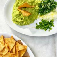 Guacamole & Chips · house made guacamole, diced onions, cilantro, & jalapeño with baked corn chips