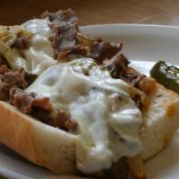 Philly Cheese Steak Sandwich · grilled onion, green peppers, mushrooms, mozzarella cheese
