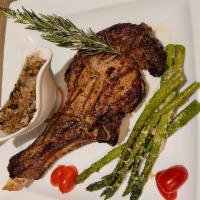 Veal Chop   · Rack of Veal with Portobello mushrooms creamy sauce and side dish